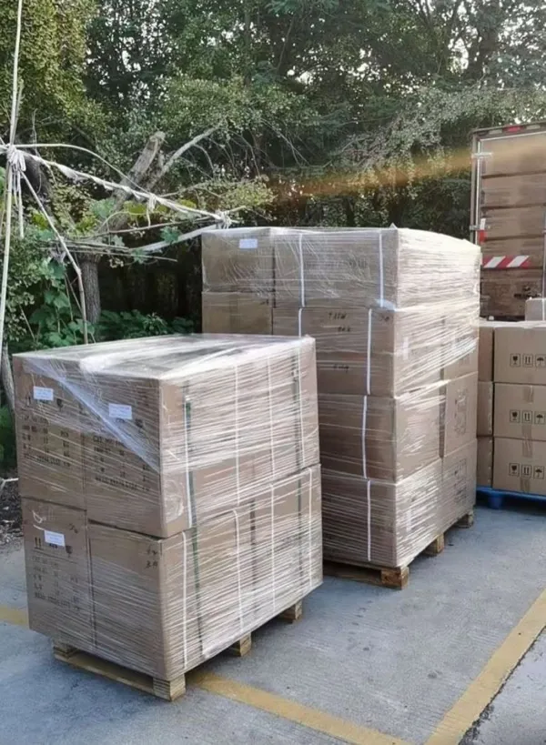 Wrapped pallet bundles stacked in China warehouse awaiting consolidation and export