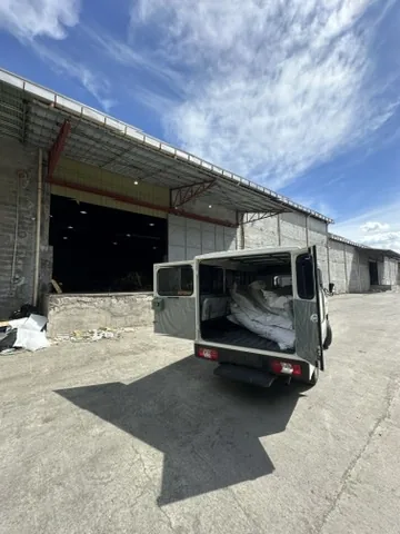 Cargo van parked at warehouse doors ready for delivery