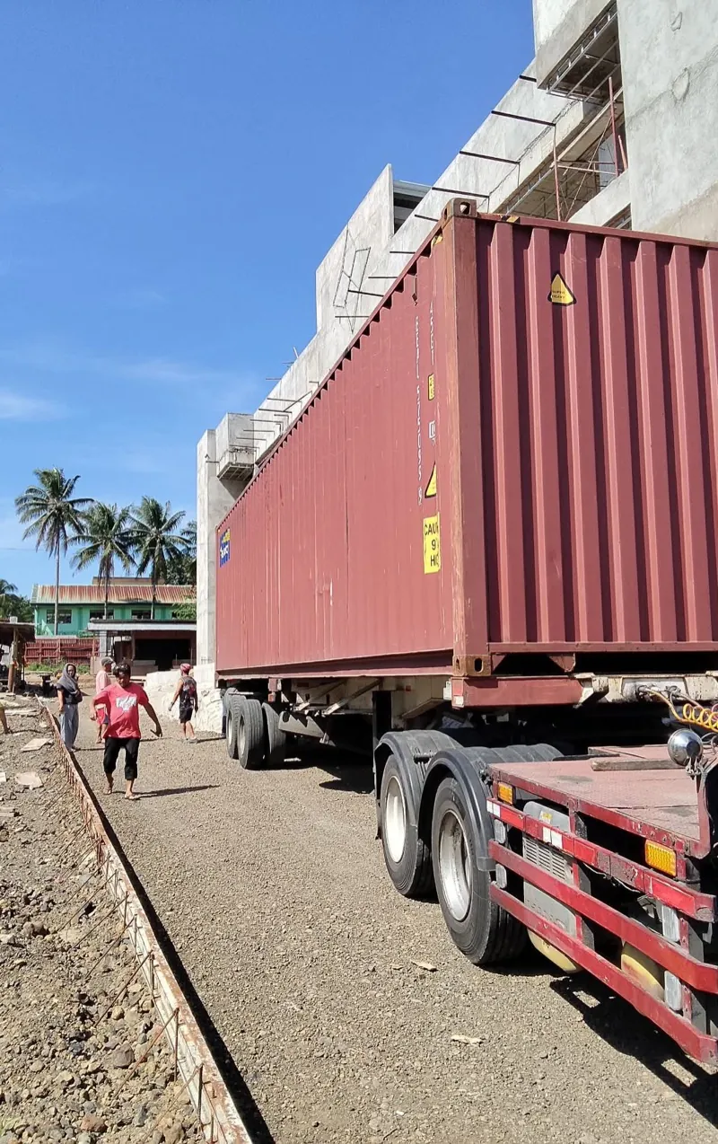 Heavy cargo and oversized freight staged on warehouse floor ready for dispatch